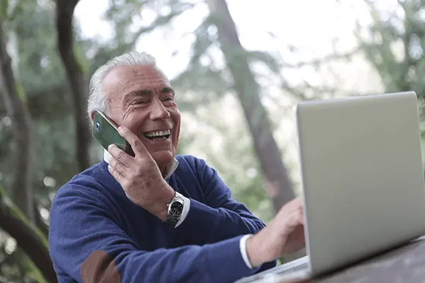 elderly-man-laptop-phone
